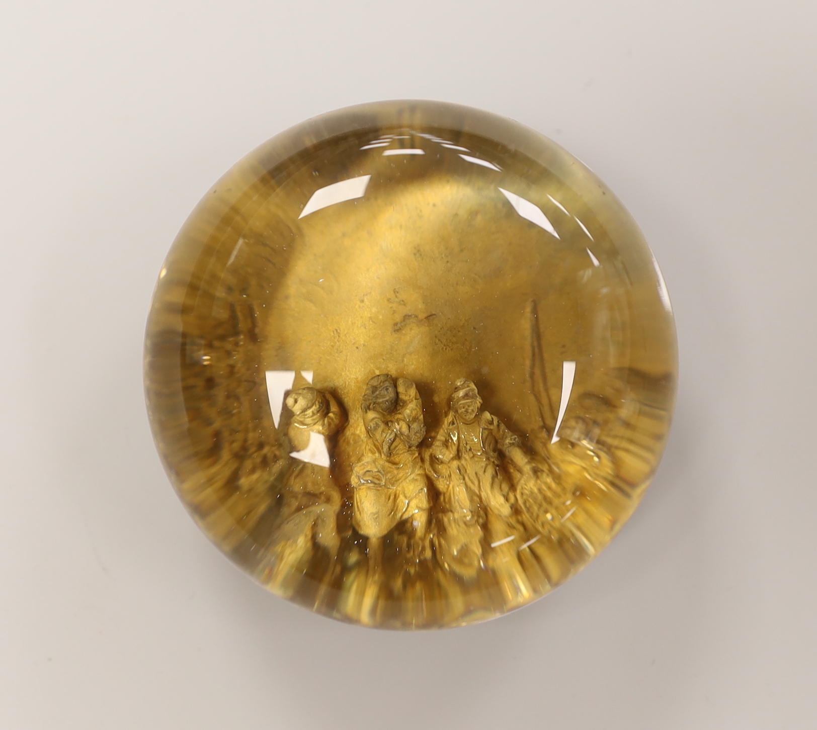 A pinchbeck figural paperweight, approximately 6cm diameter